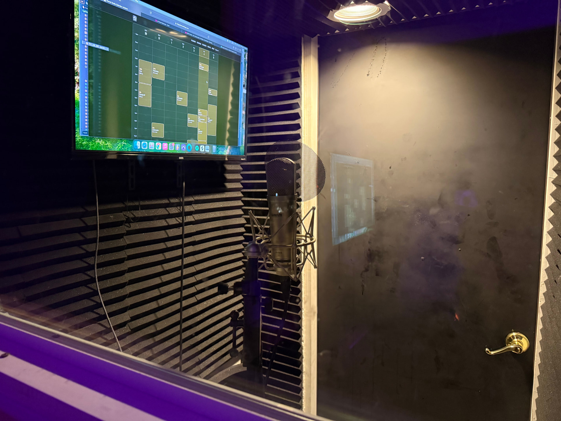 Vocal booth interior with microphone and acoustic treatment
